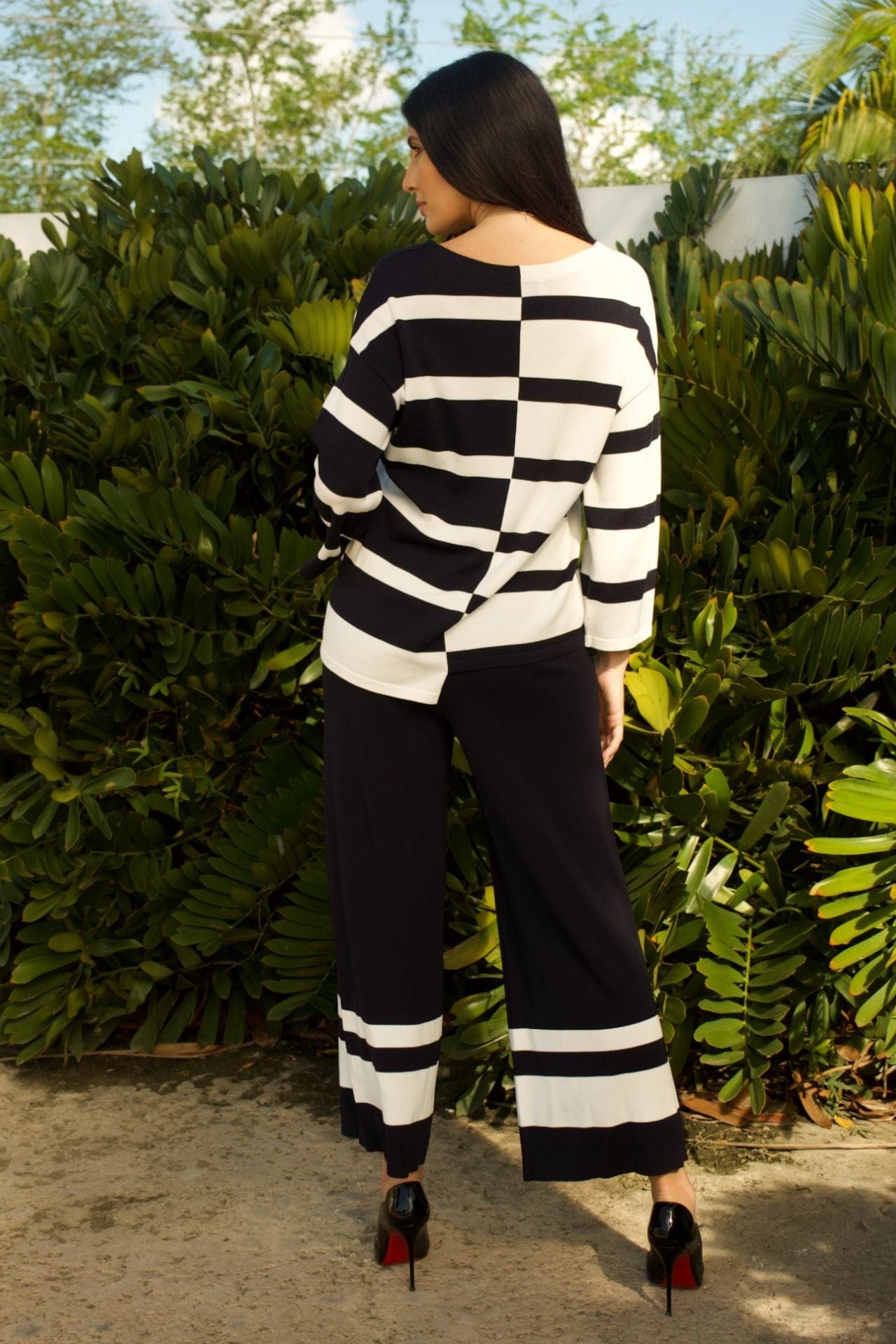 Back view of striped two-piece set with wide-leg pants and elastic waist.