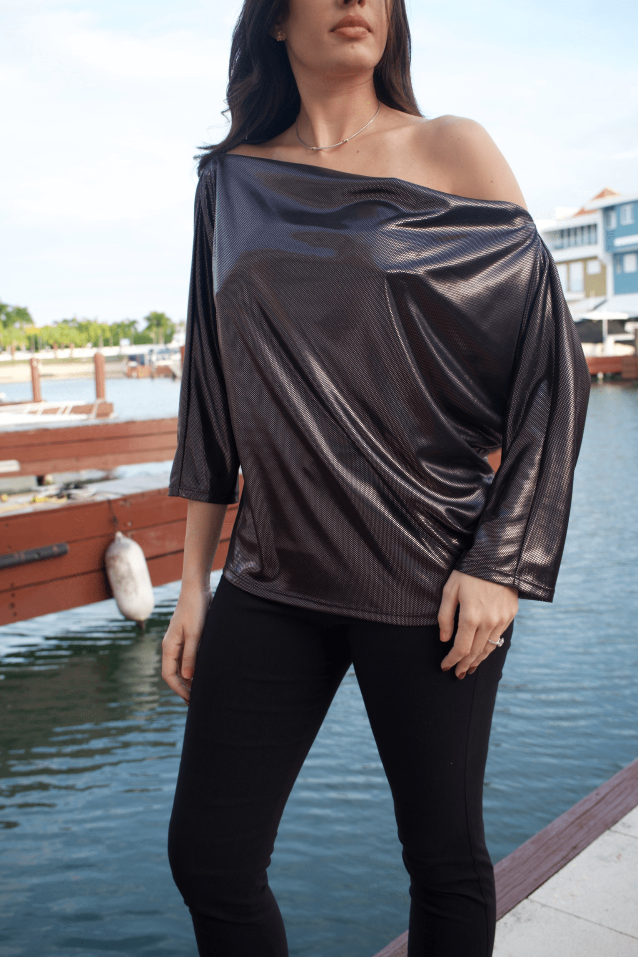 Close-up of the Metallic Dots Jersey Off Shoulder Top highlighting the sparkling metallic details on soft jersey fabric.