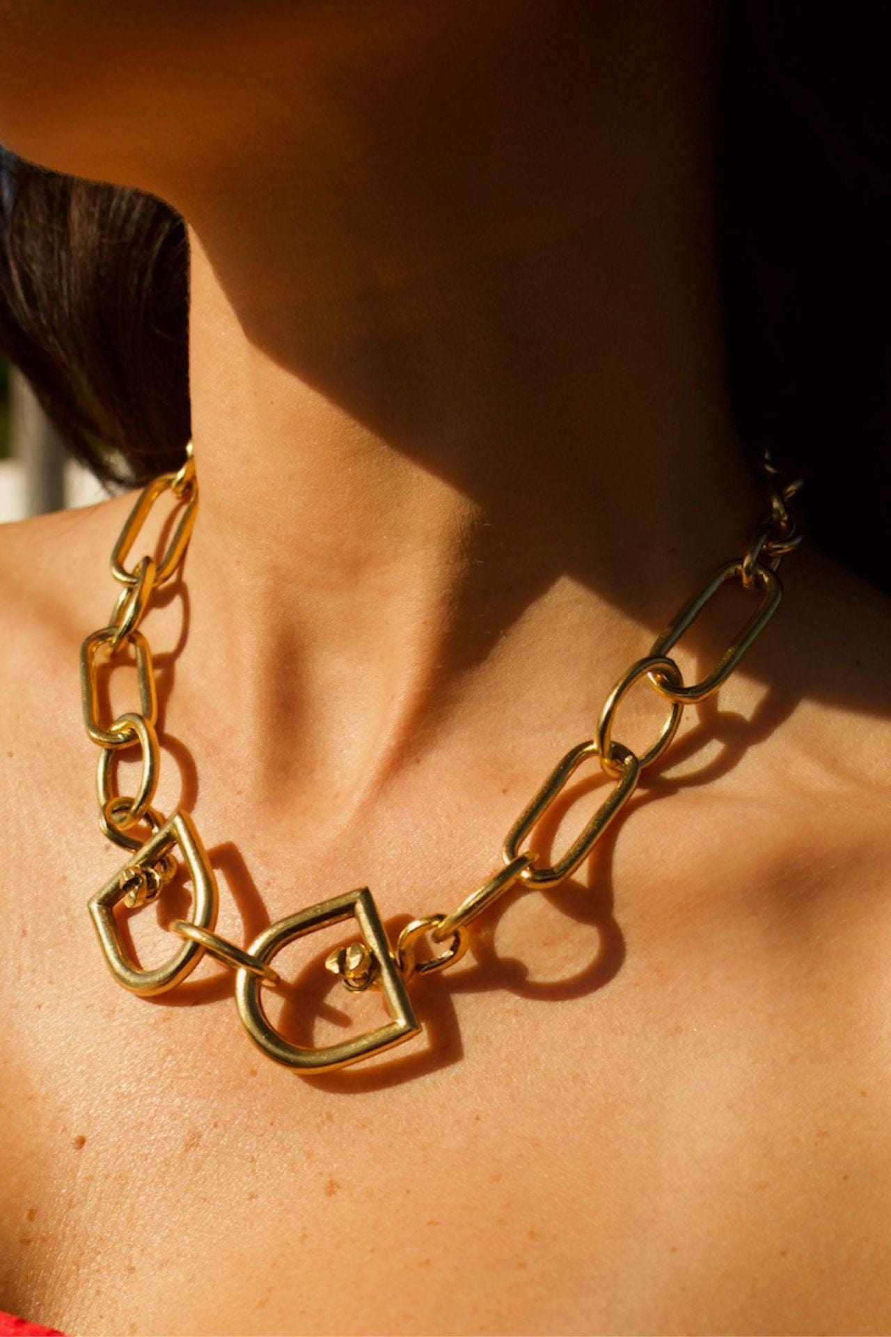 Gold brass mixed link necklace with buckle detail worn by model — handmade and coated in 22k gold