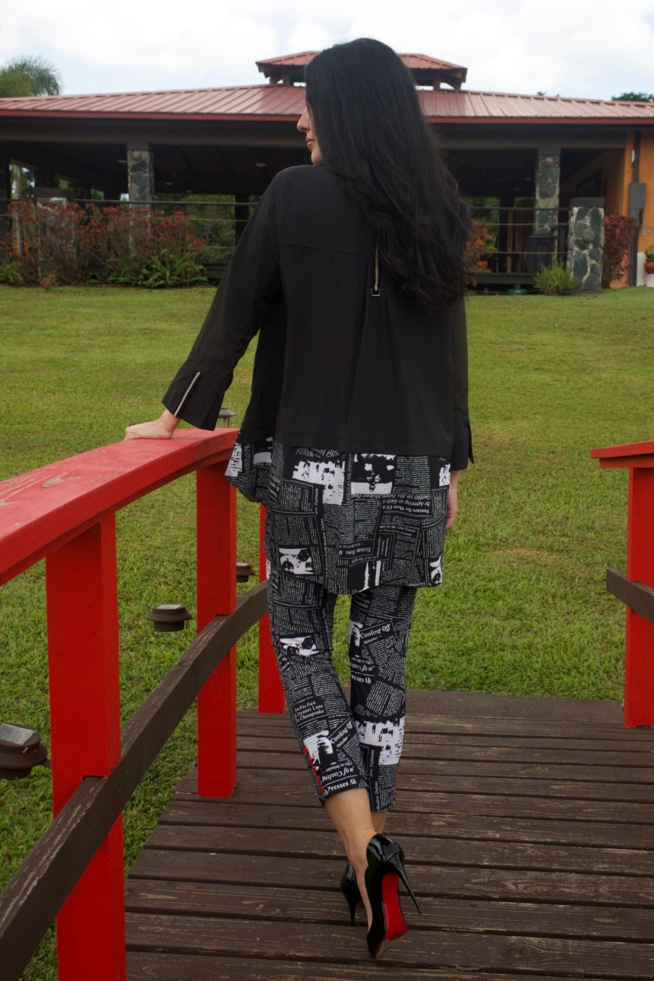 Back view of the outfit showing slit at pant hem and graphic print