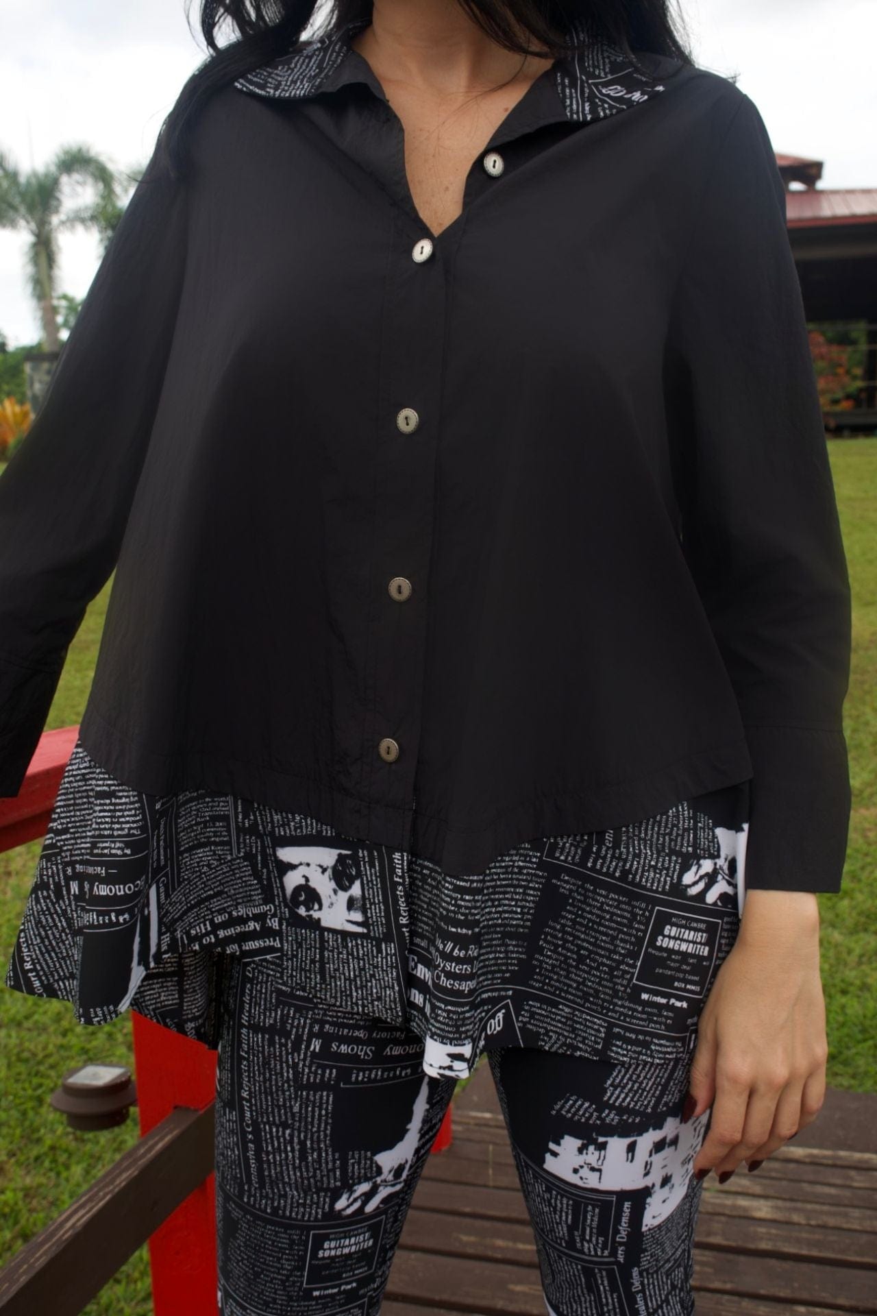 Closeup highlighting relaxed fit and drape of top.