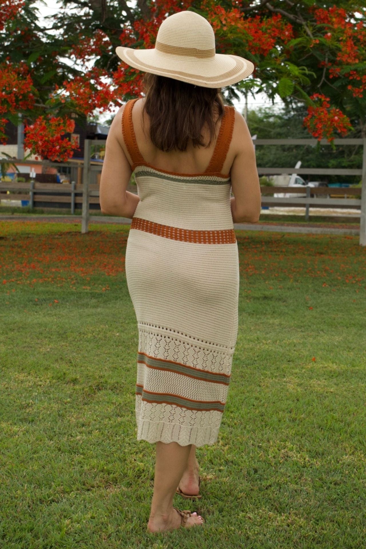 Crochet midi dress – back view, fitted silhouette and open-knit detail.