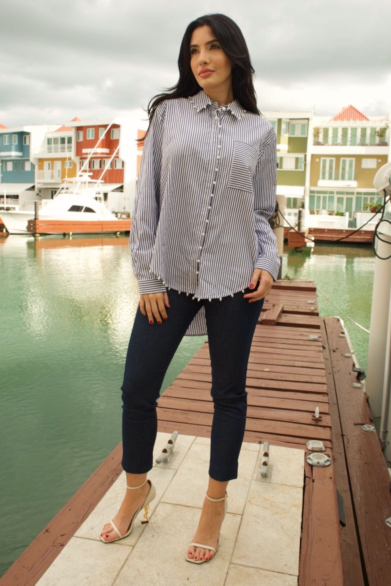 Navy and white striped blouse with long sleeves, pearl trim, and front pocket