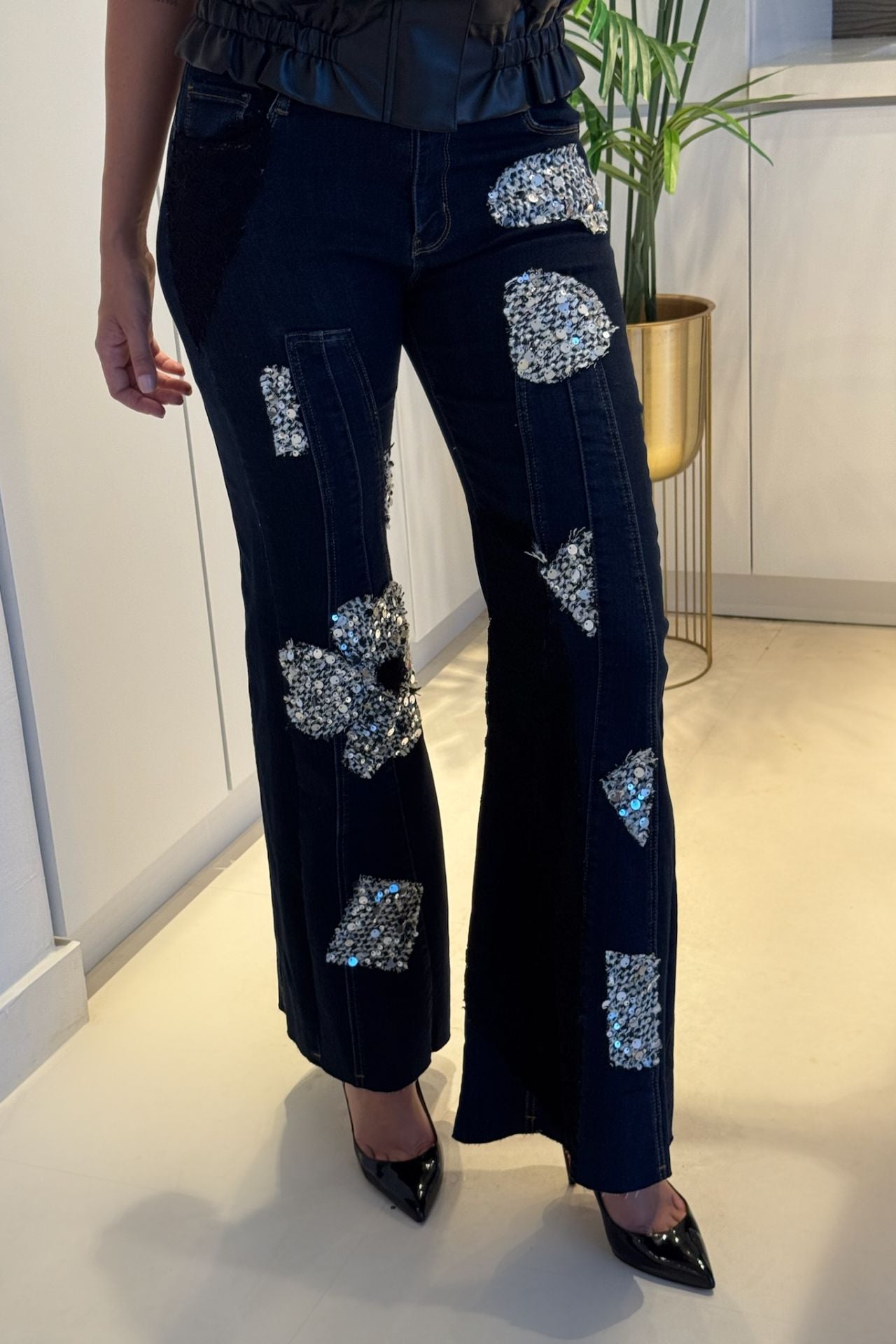 Woman wearing elegant denim jeans styled for a chic, modern look.