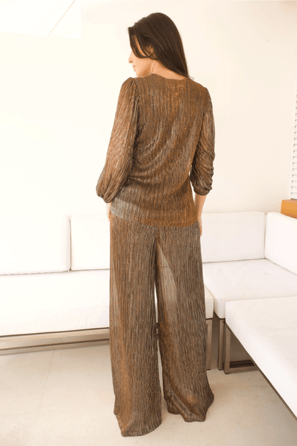 Back view of the Women's Metallic Radiance Pleated Set showcasing the flowing pleated details.