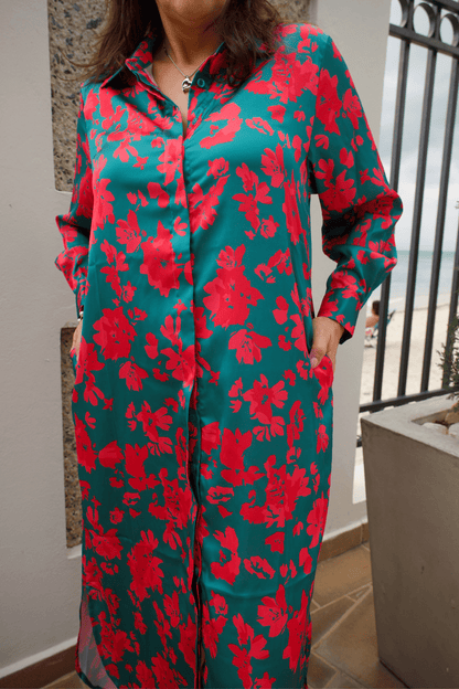 Detailed view of the floral print on a women's green satin button-down maxi dress, highlighting its refined and stylish design.