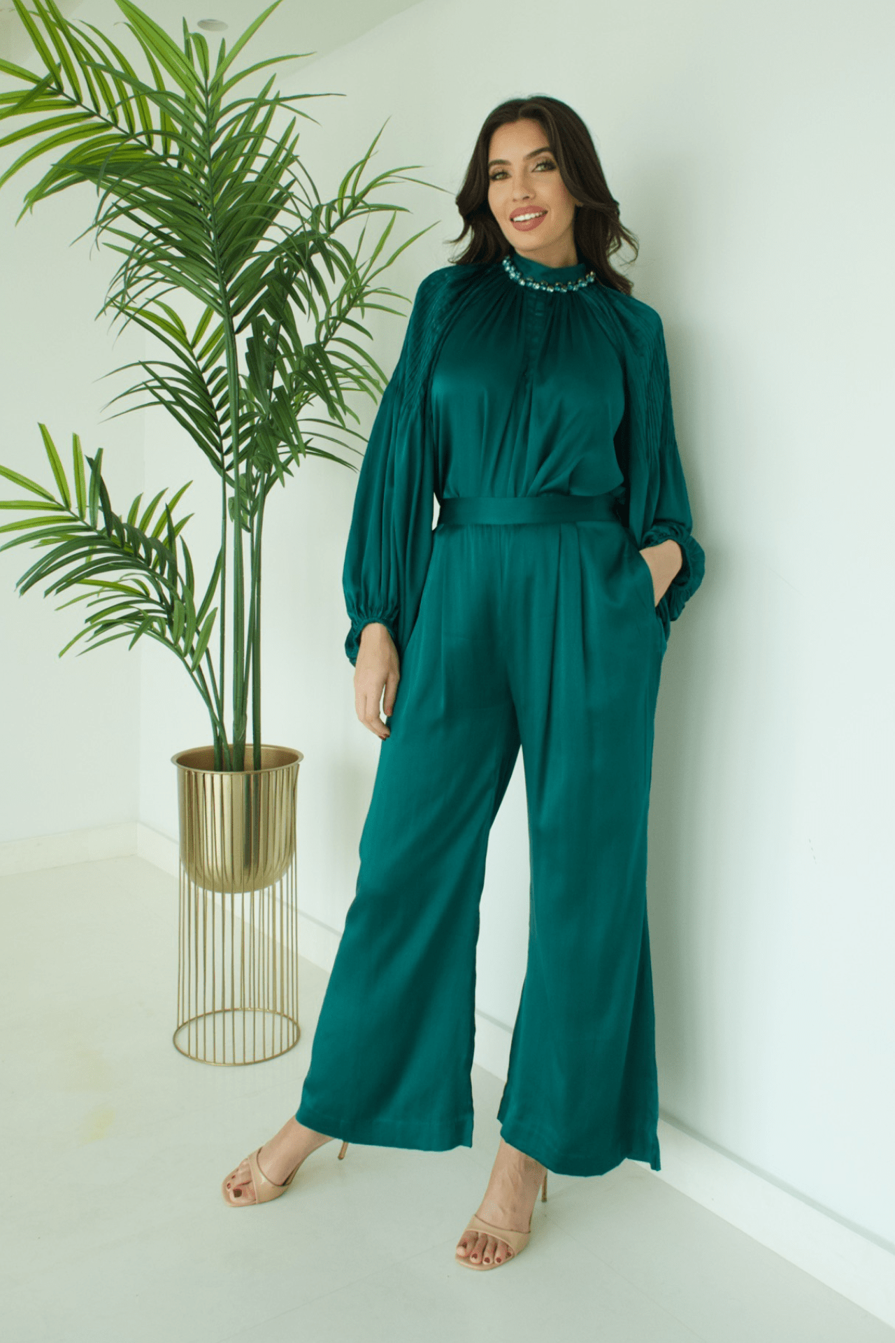 Front view of the Women's Green Satin High Neck Top with Blue Stone Details and Pant Set, featuring a luxurious satin finish and elegant embellishments.