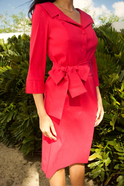 Close-up of sailor collar and taffeta texture on hot pink dress.