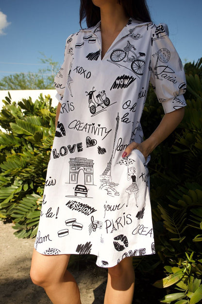 Close-up of black Parisian illustrations and puff sleeve texture.