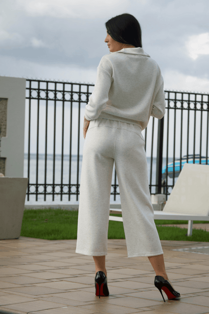 Back view of women's ivory casual pant set with wide-leg trousers, offering a sophisticated and modern look.