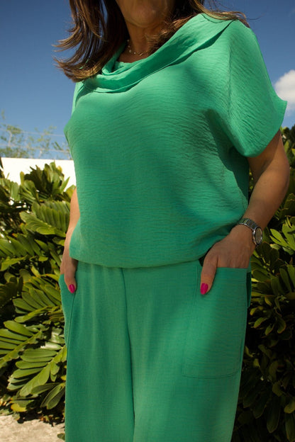 Close-up of cowl neckline and fabric texture in hope green.