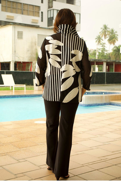  Back view of black mesh jacket with intricate white leaf embroidery, sheer and lightweight design.