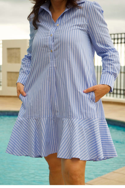 Close-up of side pockets and button details on Women's Light Blue & White Striped Drop Waist Shirt Dress – combining style and functionality.