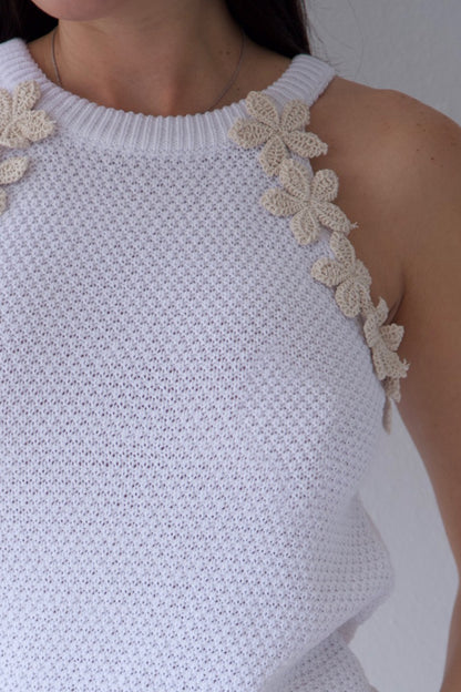 Textured ivory knit top featuring delicate floral accents