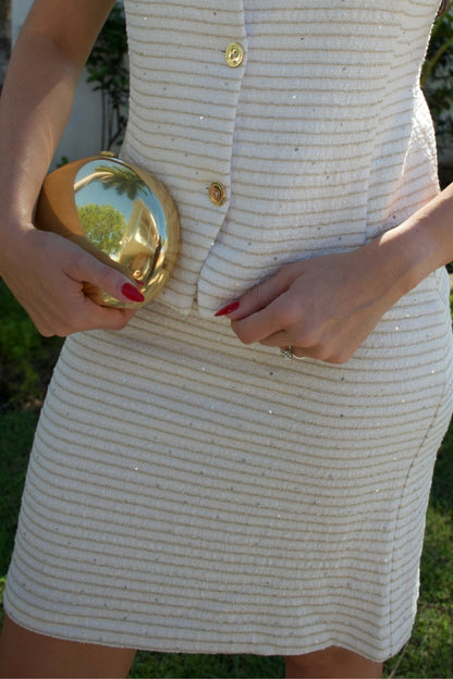 Ivory textured mid-length skirt with subtle metallic accents — Elegance Boutique