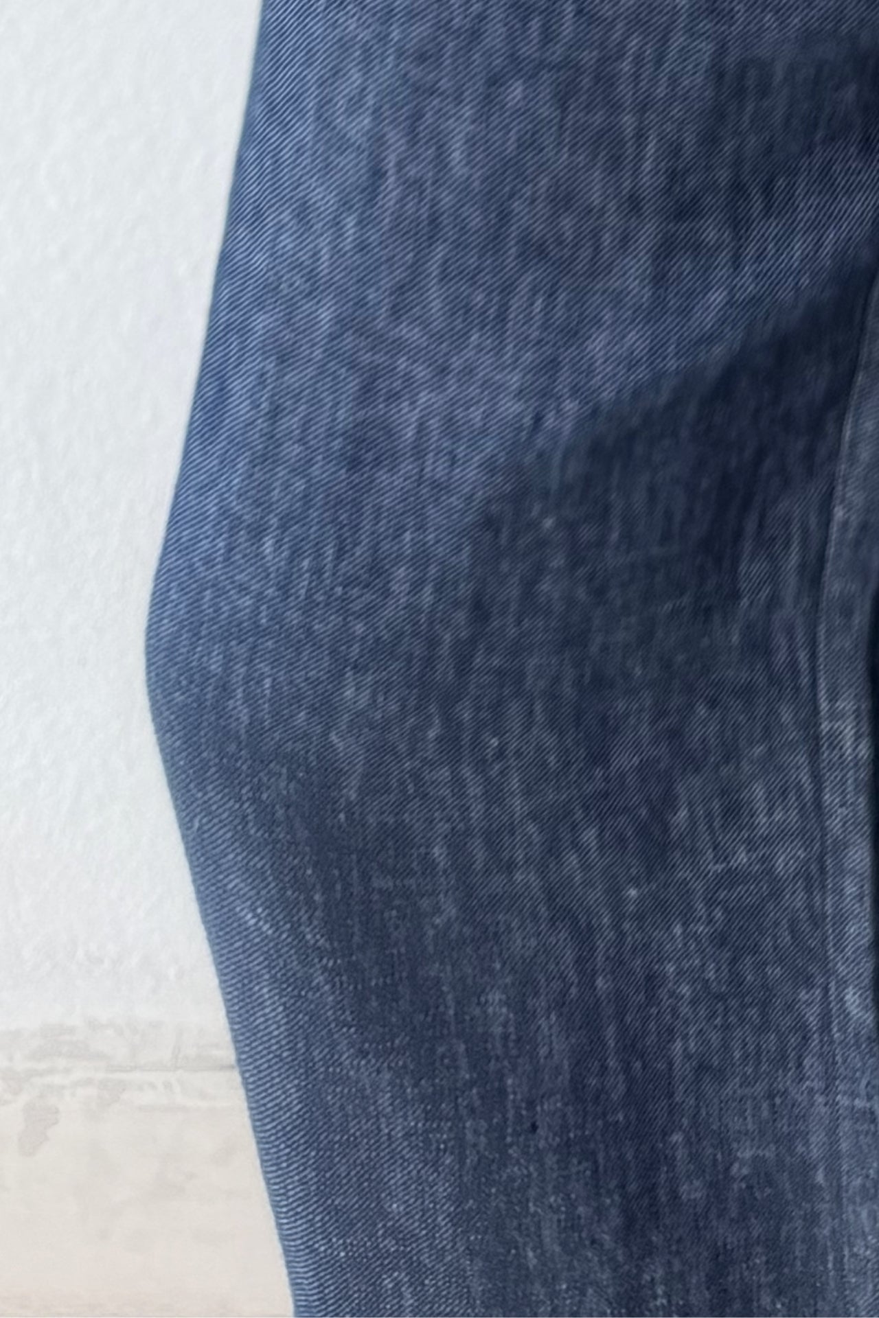Close-up of blue linen fabric on a light background