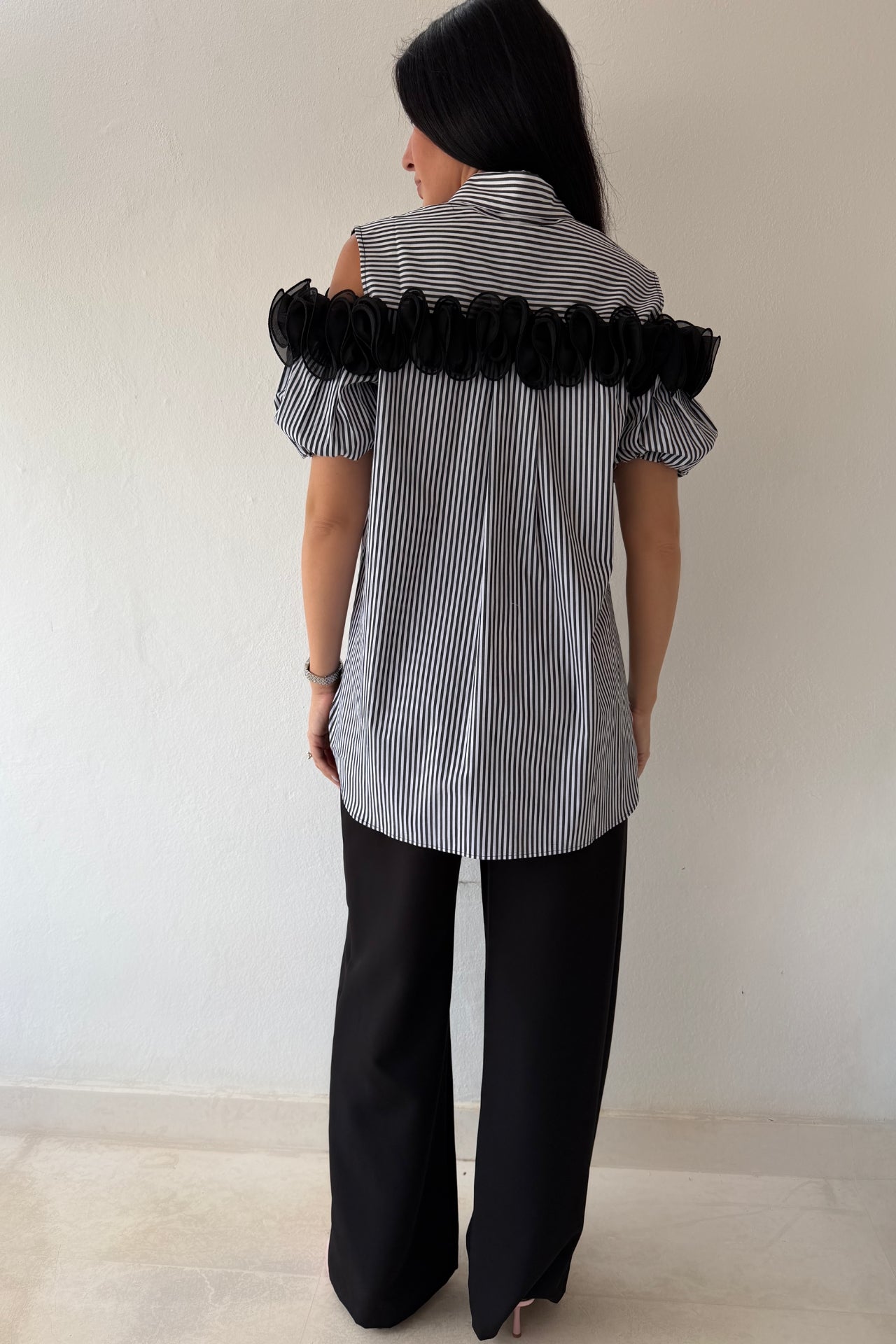 Black and white striped blouse with statement floral trim