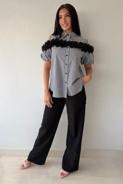 Black and white striped blouse with statement floral trim