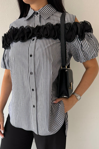 Black and white striped blouse with statement floral trim