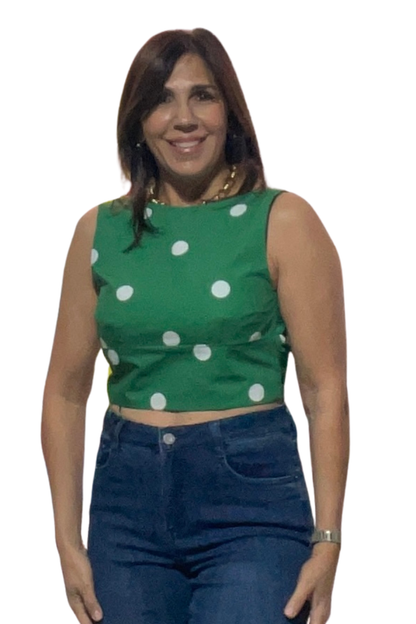 Monaco Polka Top in green and white styled with white trousers, front view