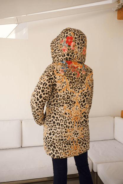 Back view of the Reversible Down Parka Jacket showcasing the striking animal print design.
