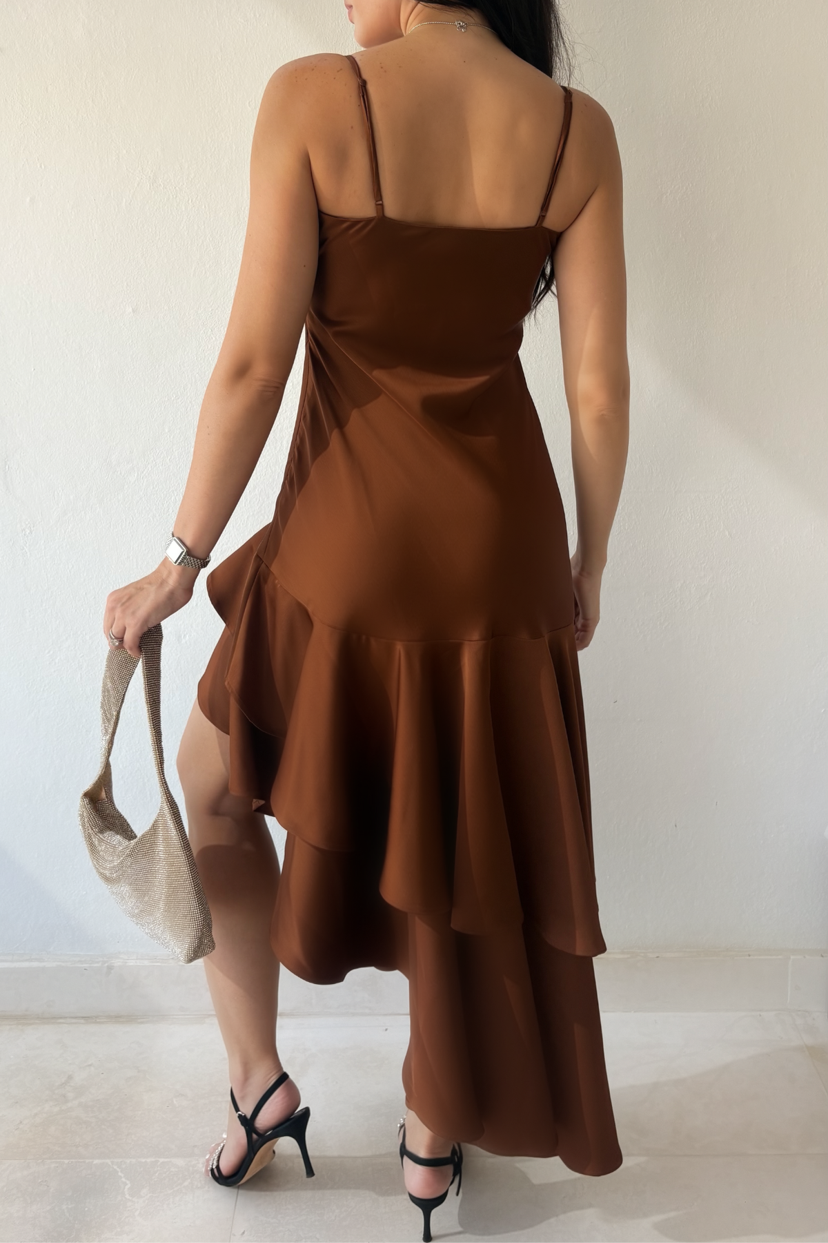 Sienna Cascade Dress in copper brown with spaghetti straps and layered high-low ruffles, back view.