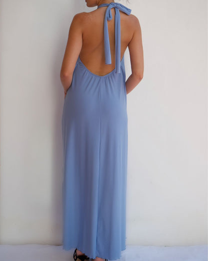 back view of baby blue halter maxi dress with flowing silhouette and soft draped fabric, elegant sleeveless summer dress for day-to-night occasions