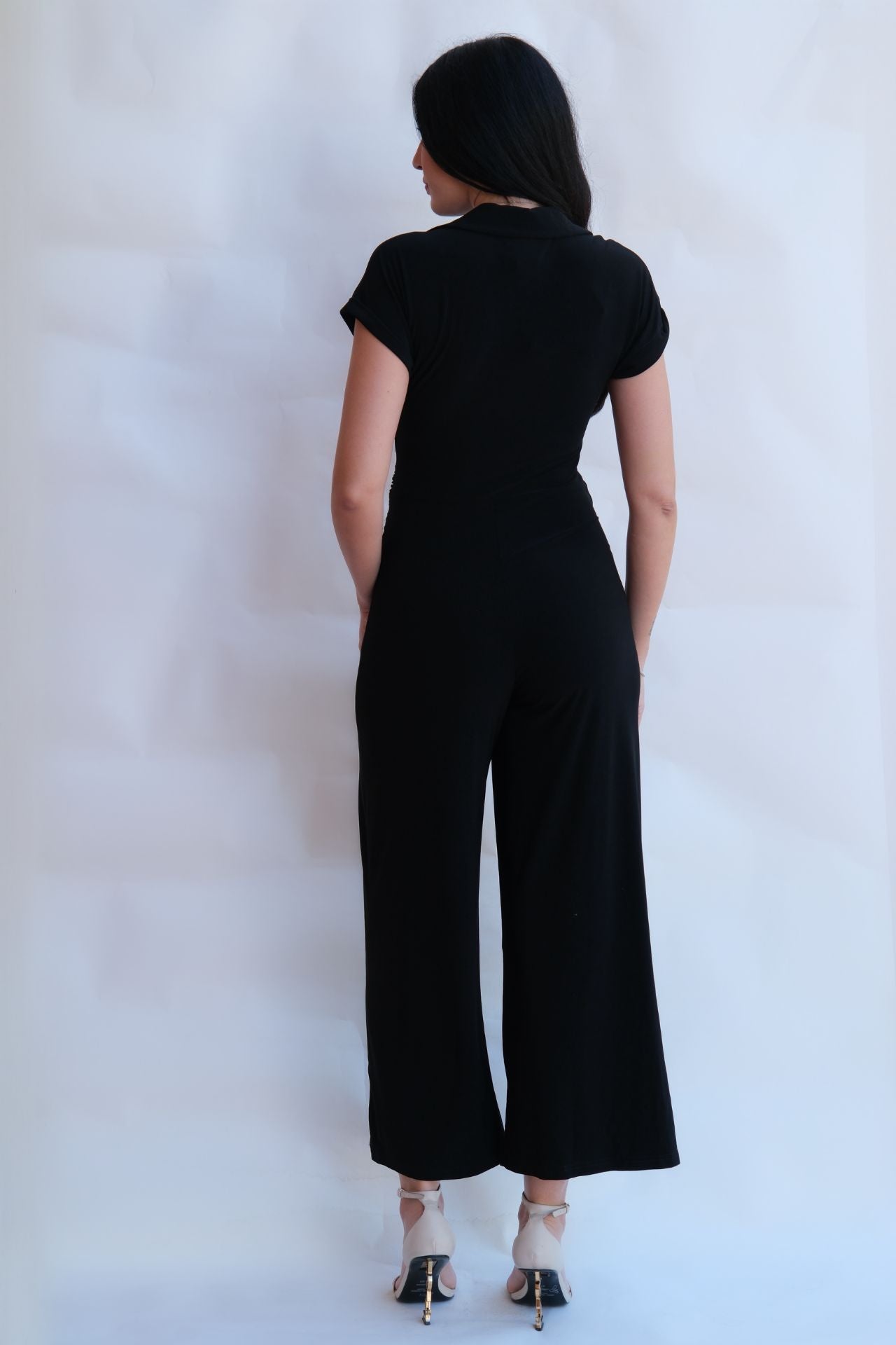 black draped zip front jumpsuit with wide leg silhouette elegant women outfit available online and in-store