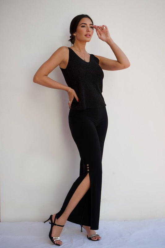 Black pull-on dressy pants with gold button side slit detail and elegant wrinkle-free stretch fabric styled for evening wear