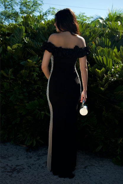 Model wearing black off-shoulder ruffle gown with beaded side panels — formal evening wear Elegance Boutique