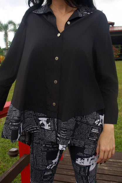 Closeup highlighting relaxed fit and drape of top.