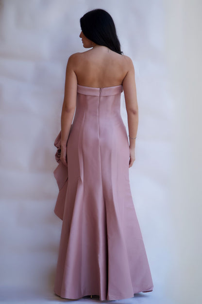 Back view of blush floor-length satin gown with clean silhouette and zipper closure