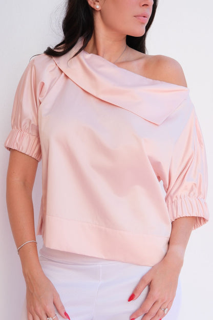 Soft pink satin blouse with relaxed fit and elastic sleeves styled for chic casual elegance