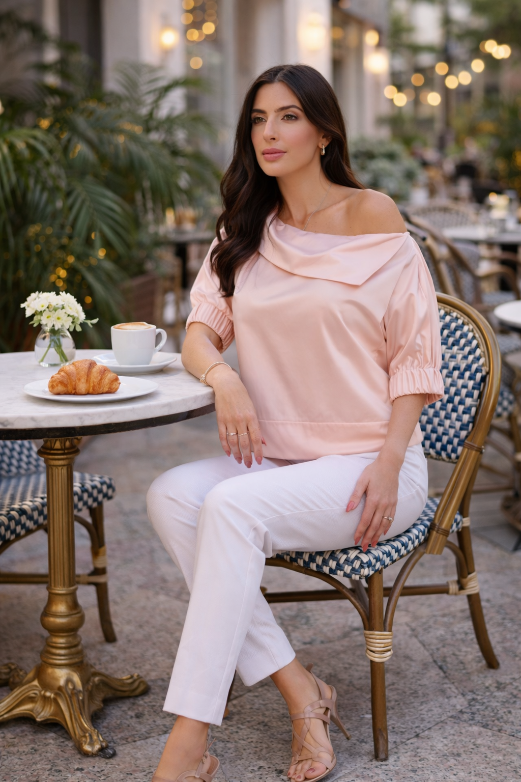 Soft pink satin blouse with relaxed fit and elastic sleeves styled for chic casual elegance