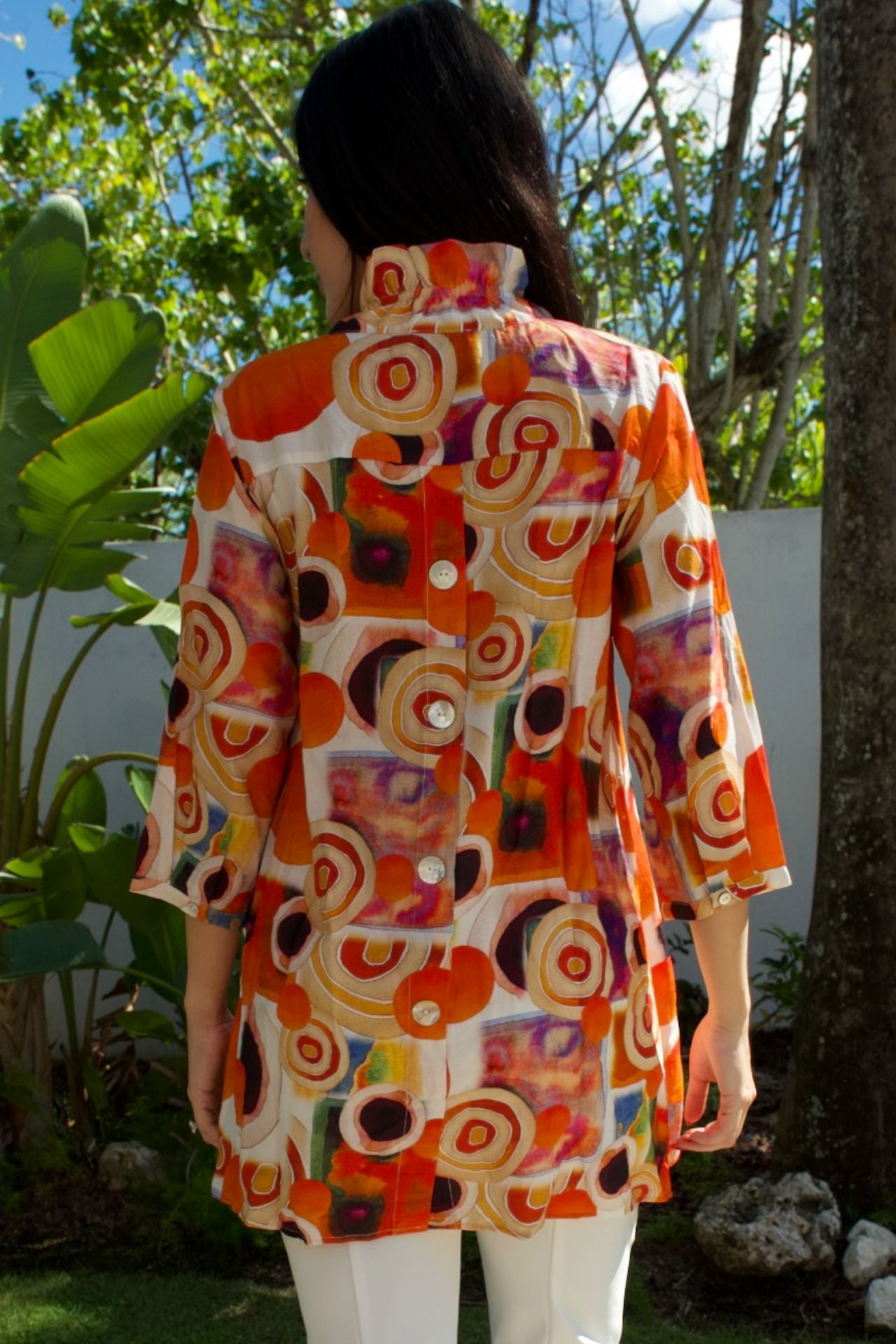 Bold multicolor circle-print tunic with button-down front — vibrant artistic top Elegance Boutique