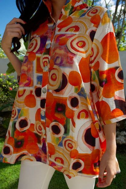 Bold multicolor circle-print tunic with button-down front — vibrant artistic top Elegance Boutique
