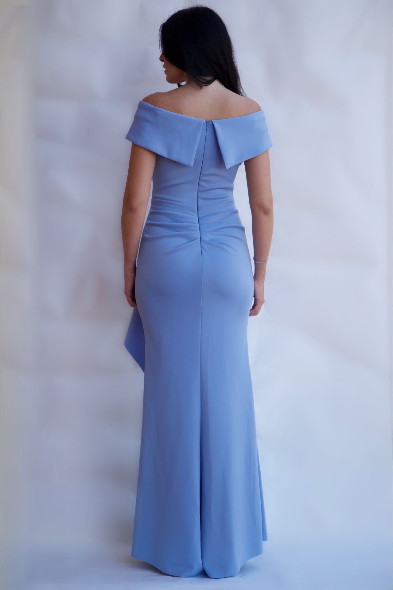 Back view of celestial blue off-shoulder mermaid evening gown showing fitted back and zipper closure available online and in-store
