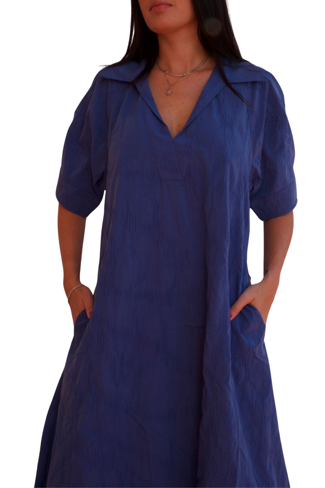 Blue midi shirt dress with relaxed fit and pockets, elegant casual day-to-night dress.