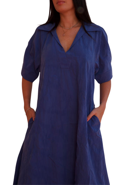 Blue midi shirt dress with relaxed fit and pockets, elegant casual day-to-night dress.