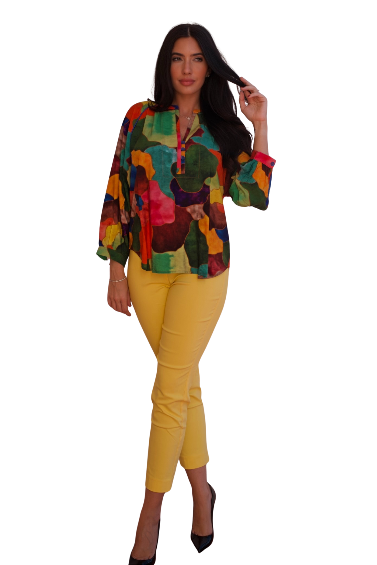 Model wearing a colorful crinkle blouse with painterly abstract print in vibrant tones.