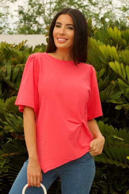 Close-up detail of Coral Twist-Front Cotton Top - twist-front design and vibrant coral texture.

