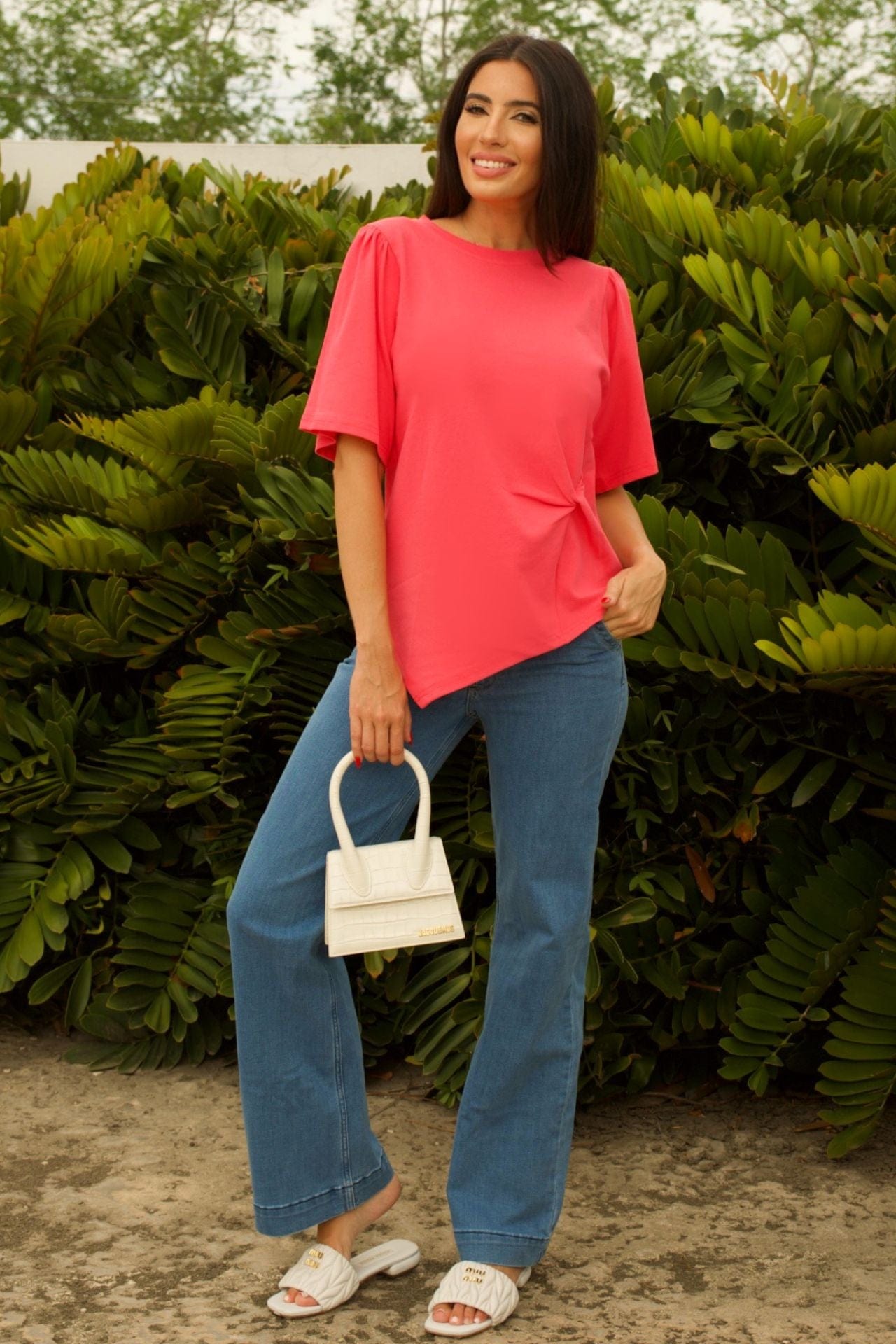 Coral Asymmetrical Twist-Front Cotton Top - front view, short sleeve top with twist detail and asymmetrical hem.
