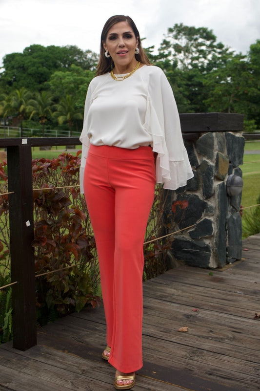 Woman wearing coral wide-leg dressy pants 