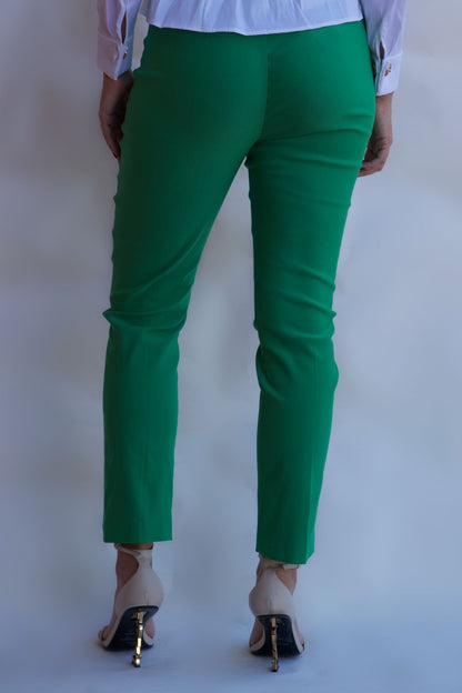 Emerald green tailored pull on pants with front pockets and silver buttons styled with white blouse available online and in-store