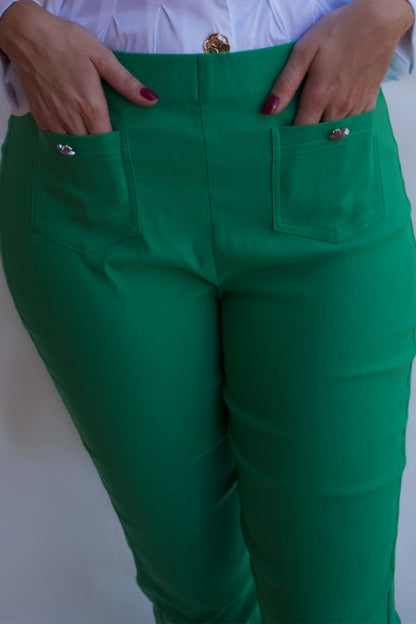 Emerald green tailored pull on pants with front pockets and silver buttons styled with white blouse available online and in-store