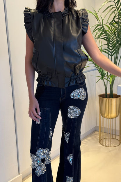 Dark wash wide-leg denim with floral sequin appliqué patches and high-rise fit.