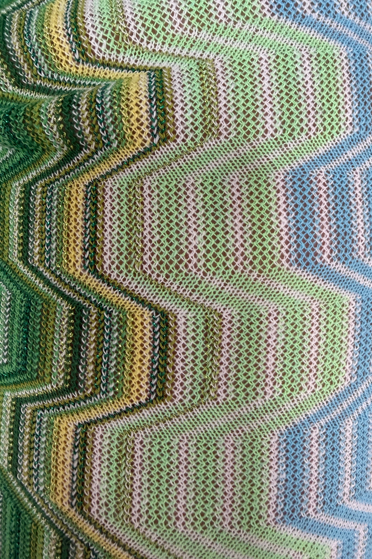Green and blue wave print detail.