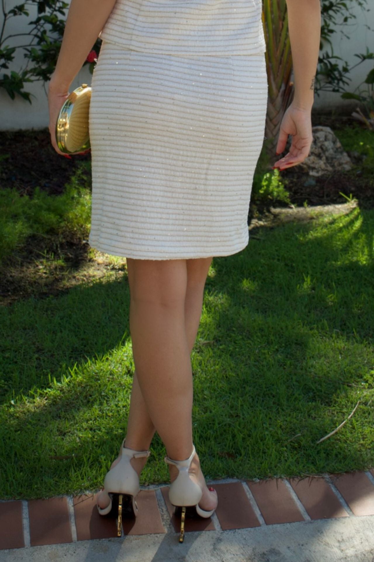 Ivory textured mid-length skirt with subtle metallic accents — Elegance Boutique