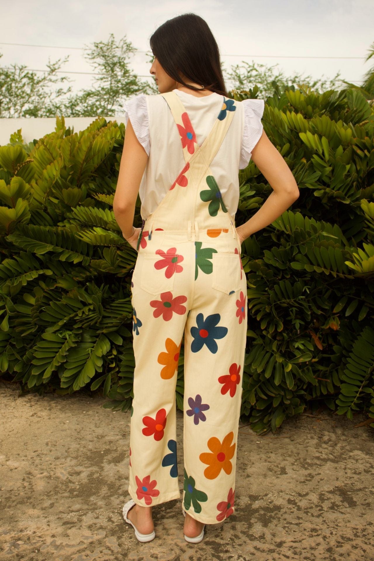 Light Groovy Floral Jumpsuit - back view, straight-leg silhouette with adjustable straps and floral print.