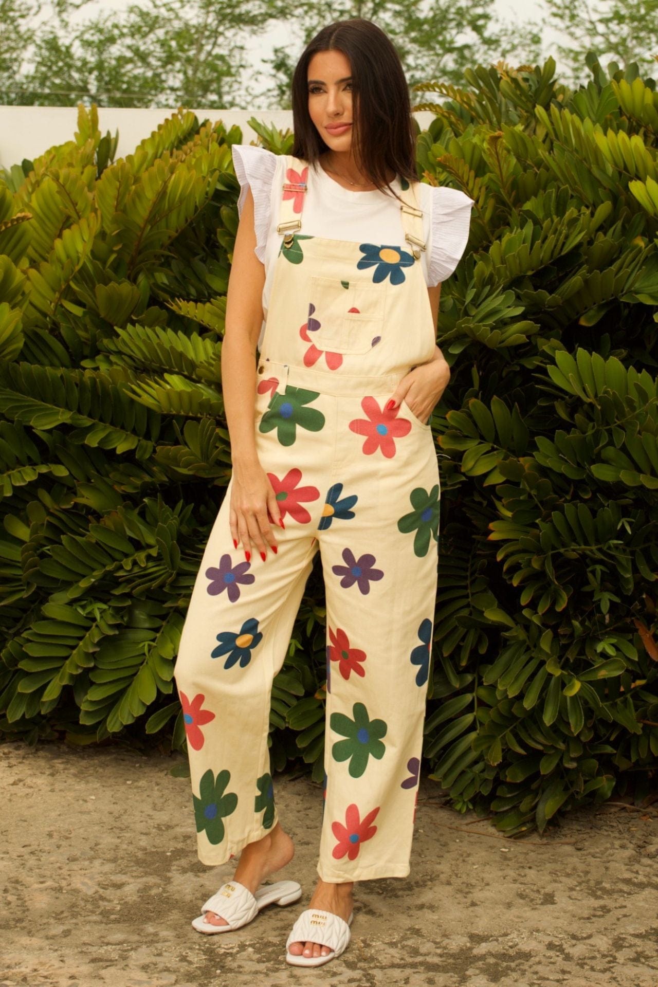 Light Groovy Floral Jumpsuit - front view, straight-leg silhouette with adjustable straps and floral print.